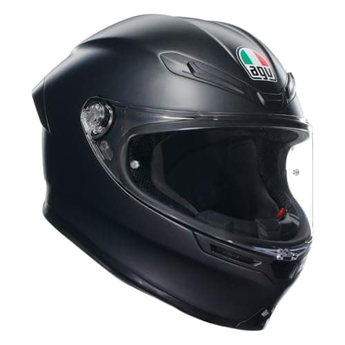 Rider in a full-face motorcycle helmet on a sport-touring motorcycle