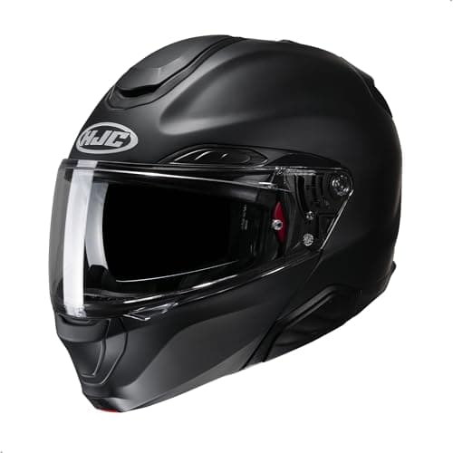 Touring rider flipping up the chin bar of a modular motorcycle helmet